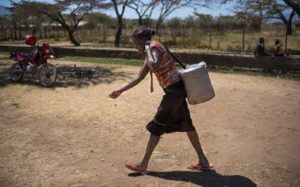 woman-carries-water