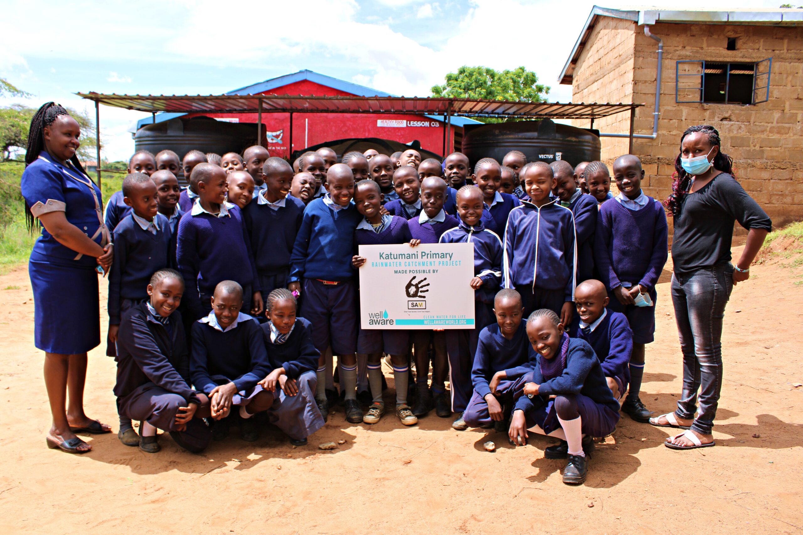 Katumani students in front of new water storage tanks