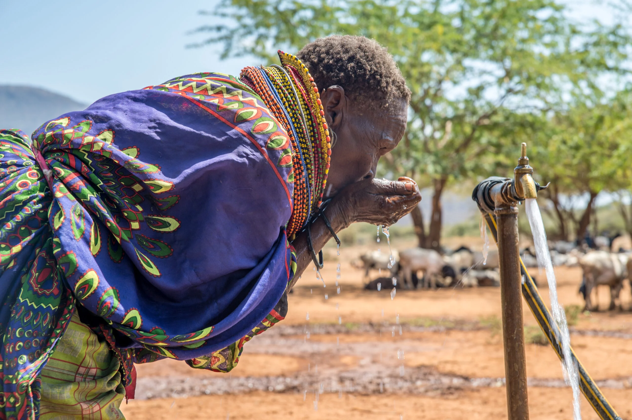 Woman Drinking Water in East Africa